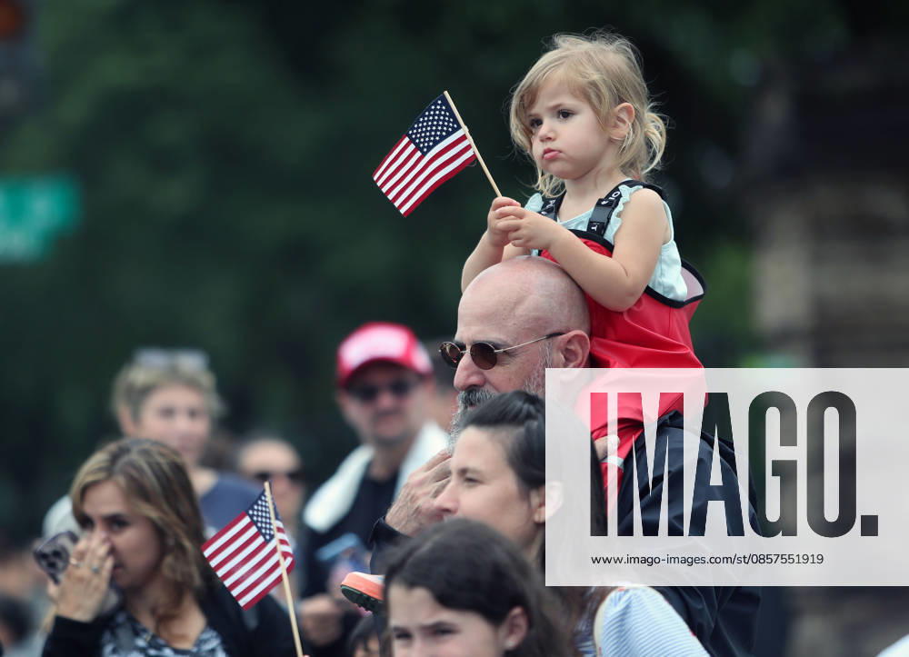 National Memorial Day Parade in Washington DC, USA. A girl holding an American flag watch the National Memorial Day Parade in Washington, DC, USA, on May 25, 2026. The parade has been held annually since 2005, marking its 21st anniversary. Washington USA