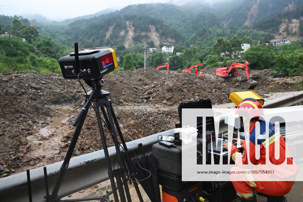 Rescuer uses slope radar to monitor mountain stability at the disaster-hit area after a heavy rainstorm hit Yongchuan District on May 25, 2026 in Chongqing, China. Record-breaking torrential rain battered Yongchuan District in southwest China s Chongqing Municipality from late May 23 to May 24, triggering flash floods, landslides and mudslides. Rescue operations are still underway as multiple towns and subdistricts suffered severe damage.