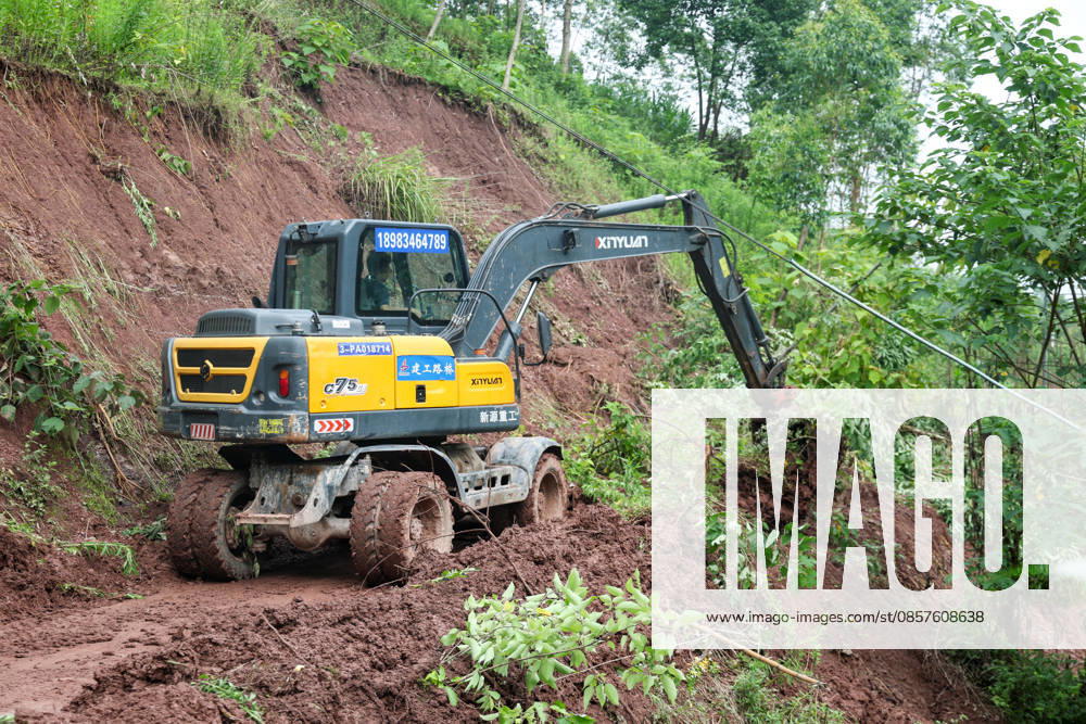 (260526) -- CHONGQING, May 26, 2026 -- Workers clear a landslide-blocked road at Xiangtanzi Village of Shuangshi Town, Yongchuan District of southwest China s Chongqing Municipality, May 26, 2026. From Saturday night to early Sunday morning, a sudden and extreme catastrophic rainstorm struck Yongchuan, triggering flash floods and geological disasters in multiple areas of this district. After the disaster occurred, the local authorities immediately activated the emergency response mechanism, coordinated rescue forces from all sides and made every effort to carry out rescue operations and infrastructure restoration. Rescue and response efforts are still underway. ) CHINA-CHONGQING-FLOOD-RESCUE (CN) HuangxWei