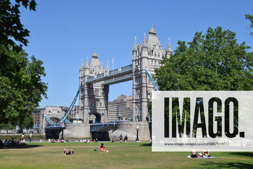 A handful of people sunbathe in the scorching sun in Potters Fields Park next to Tower Bridge while most sit in the shade as temperatures soar in the capital. The UK recorded its hottest ever day in May yesterday. London United Kingdom - ZUMAv130 20260526_zip_v130_010
