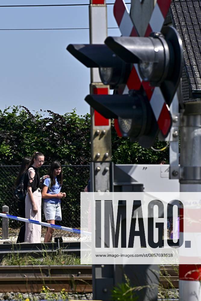 People mourn and lay flowers at the spot of Tuesday s tragic train accident in Buggenhout, on Wednesday 27 May 2026. The accident happened around 8:15 am. Four people have been killed, the driver, two children and their supervisor. According to initial reports, the level crossing was closed at the time of the accident. DIRKxWAEM 175161909