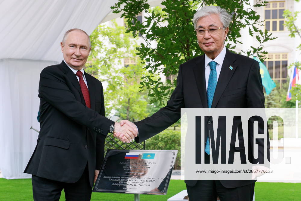 KAZAKHSTAN, ASTANA - MAY 28, 2026: Russia s President Vladimir Putin (L) and Kazakhstan s President Kassym-Jomart Tokayev shake hands during a tree-planting ceremony on the Alley of Eternal Friendship between Russia and Kazakhstan. Alexander Shcherbak TASS 93130275