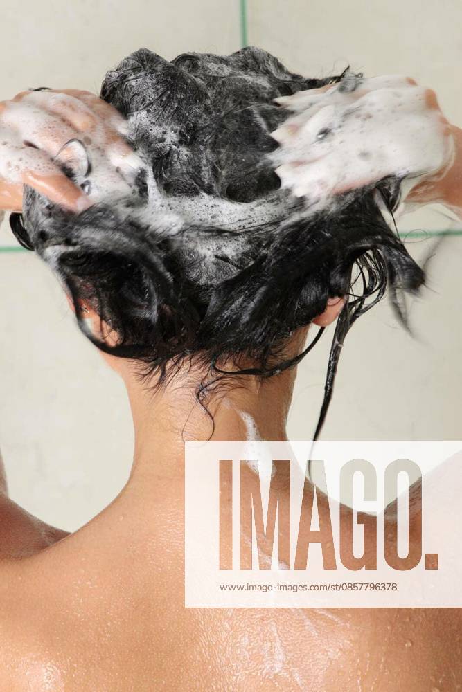 Young woman in shower washing her hairs model released Symbolfoto