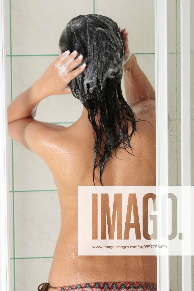 Young woman in shower washing her hairs model released Symbolfoto