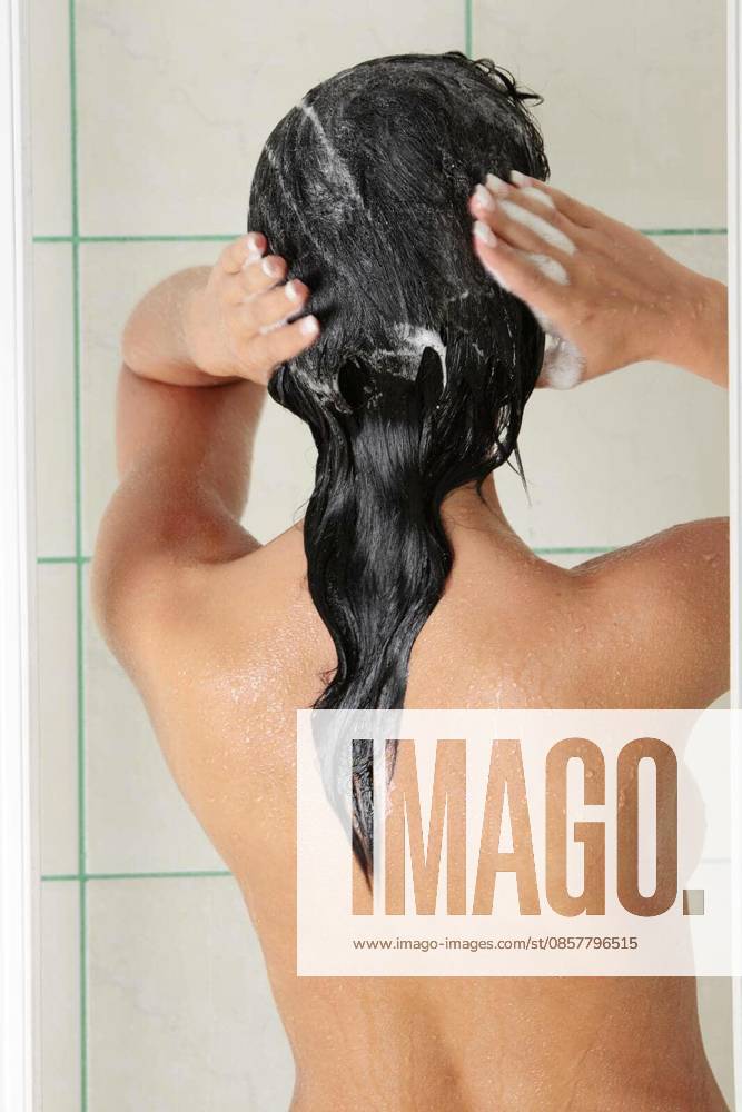 Young woman in shower washing her hairs model released Symbolfoto