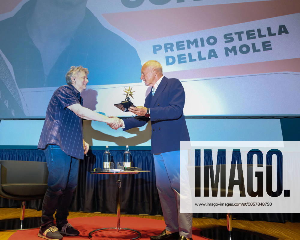 Michel Gondry Receives Stella Della Mole Award - Turin French director Michel Gondry receives the Stella della Mole award from National Cinema Museum president Enzo Ghigo at Cinema Massimo in Turin, Italy, on May 28, 2026, in recognition of his important and fundamental contribution to the art of filmmaking, while also holding a masterclass and introducing the screening of the film Microbo&Gasolina. Photo by Costantino Sergi IPA ABACAPRESS.COM Torino Torino
