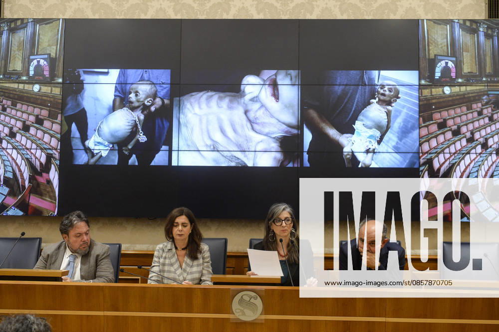 IPA85160294 - Rome Senate presentation of UN special rapporteur s report on the occupied Palestinian territories, pictured Dario Carotenuto Laura Boldrini Francesca Albanese Peppe De Cristofaro in the background images from Gaza