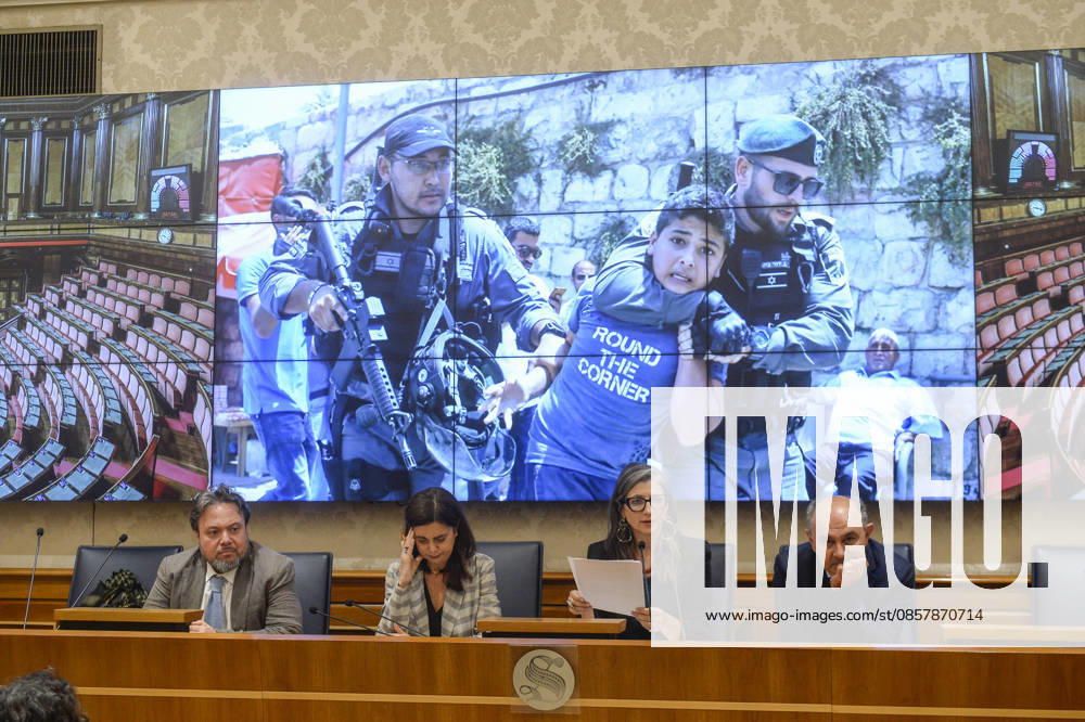 IPA85160345 - Rome Senate presentation of UN special rapporteur s report on the occupied Palestinian territories, pictured Dario Carotenuto Laura Boldrini Francesca Albanese Peppe De Cristofaro in the background images from Gaza