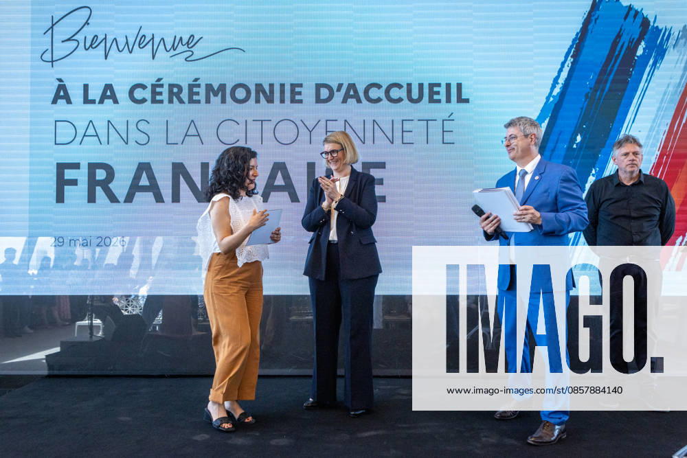 Welcoming Ceremony for French Citizenship At Eiffel Tower - Paris Marie-Pierre Vedrenne (Minister Delegate to the Minister of the Interior, in charge of Citizenship) gives the certificate for obtaining citizenship at the Tour Eiffel, for welcoming ceremony for French citizenship chaired by Mrs.Marie Pierre Vedrenne, Minister Delegate to the Minister of the Interior, in charge of Citizenship Paris, France May 29, 2026. Photo by Franck Derouda ABACAPRESS.COM Paris Eiffel Tower France