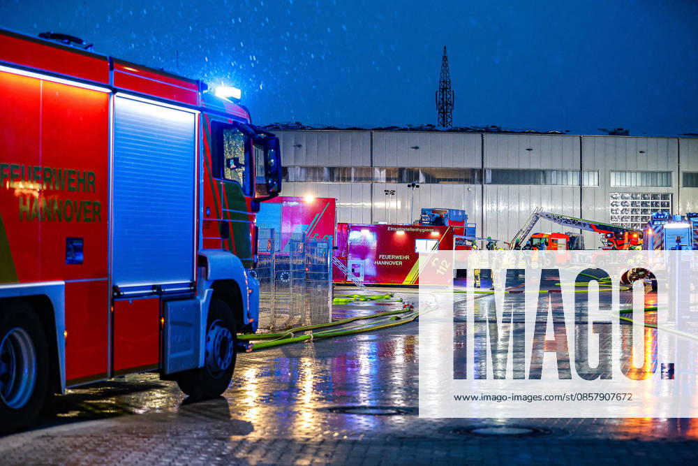 Large fire in a warehouse and logistics hall GTLF left, emergency hygiene component center, turntable ladder in the background Hanover Anderten Lohweg 7, Lower Saxony industrial estate, Hanover region Germany