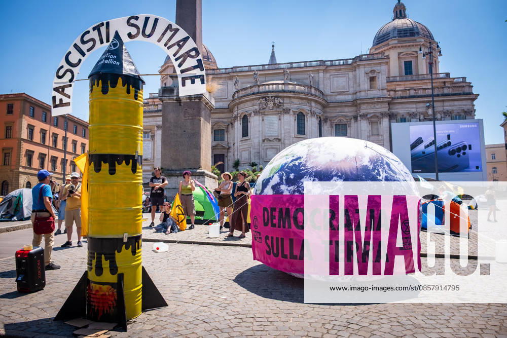 Extinction Rebellion activists are launching a 24-hour rally in Piazza dell Esquilino, just days before the 80th anniversary of the Italian Republic on June 2nd. They say: there is nothing to celebrate as long as rights, justice, and dignity continue to be denied. Oil extraction is imposed through violence and war to produce ever more energy, further increasing inequality. Activists assembled a rocket made of oil drums. It reads: Fascists on Mars. Democracy on earth reads the banner. Rome Italy - ZUMAg256 20260530_znp_g256_002