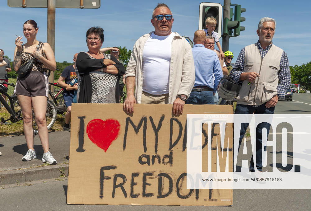 Counter-demonstrator with poster I love my Diesel and Freedom 20260530ad275 Future instead of gas Demonstration against the