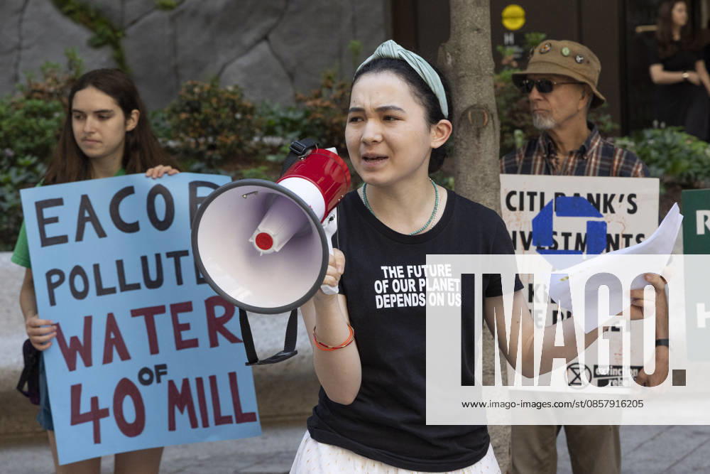 Climate activists protesting Chase bankâ€⠢s support of Total Energiesâ€⠢ East African Crude Oil Pipeline (EACOP) rally and blockade entrances to JP Morgan Chase headquarters in Midtown Manhattan before blocking traffic on Park Avenue outside the building, resulting in arrests by NYPD. Teenage climate activist AVERY TSAI speaks at the rally wearing a shirt that reads THE FUTURE OF OUR PLANET DEPENDS ON US. Demonstrators join the Kick Polluters Out Global Week of Action denouncing the pipeline for causing displacement of farmers in Uganda and Tanzania and damage to protected waterways, biodiversity areas and ecosystems. Organizations involved in the protest include Planet Over Profit, Extin - ZUMAr174 20260529_znp_r174_024