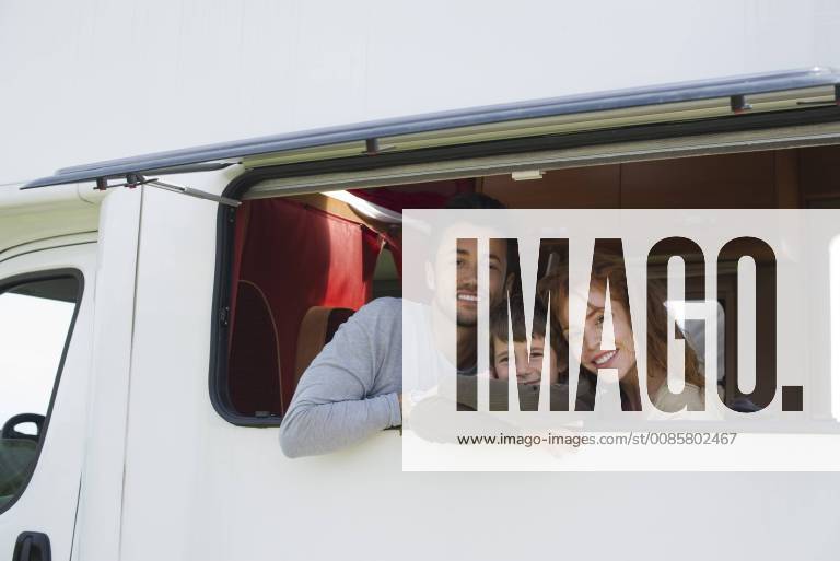 Parents and young boy in motor home, portrait