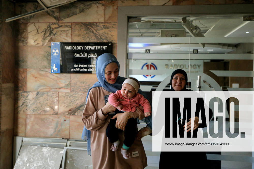 Battoul carries her 4 month old daughter Fatima at the entrance of Radiology department at Jabal Amel Hospital that was partially destroyed in Israeli air strikes in the southern Lebanese port city of Tyre. Battoul, who is married to an employee in the hospital, fled her apartment to live with her husband and daughter inside the sanatorium. Clashes have continued in southern Lebanon despite Israel and Hezbollah accepting a US plan for a partial ceasefire. President Donald Trump said he had spoken to both sides and they agreed that all shooting will stop , after Iran warned Israeli military actions in Lebanon were a threat to the US-Iran ceasefire. Tyre Lebanon - ZUMAn313 20260602_zip_n313_013
