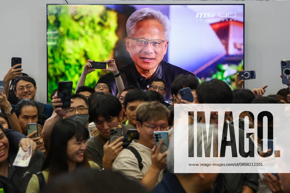 NVIDIA s CEO Jensen Huang visits COMPUTEX TAIPEI 2026 TAIPEI, TAIWAN - JUNE 3: Jensen Huang, the CEO of American multinational tech giant NVIDIA, is surrounded by heaps of supporters and staff during his visit to the COMPUTEX TAIPEI trade show, in Taipei, Taiwan, on June 3, 2026. COMPUTEX TAIPEI is one of the world’s largest and most significant trade shows, featuring latest technologies, drones, data centres, Artificial Intelligence (AI) technologies, supercomputers, semiconductors products and other things from major international firms such as Nvidia, Intel, NXP and Foxconn. Daniel Ceng Anadolu Taipei Taiwan. Editorial use only. Please get in touch for any other usage.