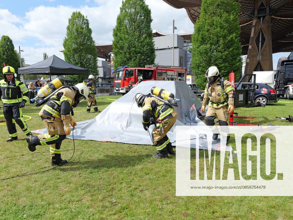 Interschutz 2026 in Hanover A burning electric car is covered with a fire blanket