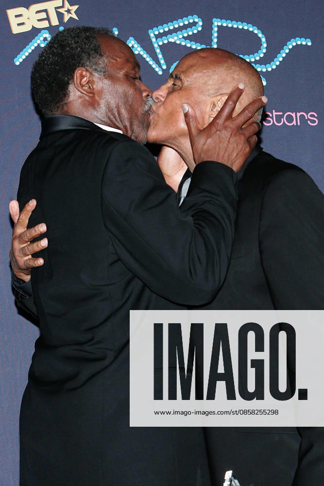 BET Awards 2006-Press Room Jun 27, 2006; Los Angeles, CA, USA; Actor DANNY GLOVER kisses HARRY BELAFONTE in the press room at the 2006 BET Awards at the Shrine Auditorium in Los Angeles. Mandatory Credit: Photo by Jerome Ware ZUMA Press. ( ) Copyright 2006 by Jerome Ware Los Angeles California USA