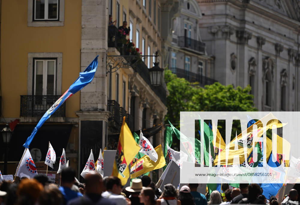 Nationwide Strike For Workers Lisbon LISBON, PORTUGAL - JUNE 03: Protesters hold a banner and wave red trade union flags as they line the streets during a national mobilization in Lisbon, Portugal on June 03, 2026. The demonstration, organized under the National Fight Day motto, demands increased wages, guaranteed labor rights, and measures against the rising cost of living, while advocating for the right to health and housing. Zed Jameson Anadolu Lisbon Portugal. Editorial use only. Please get in touch for any other usage.