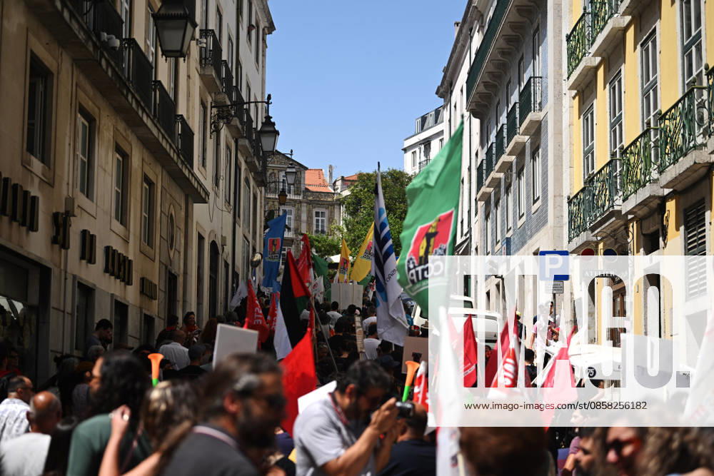 Nationwide Strike For Workers Lisbon LISBON, PORTUGAL - JUNE 03: Protesters hold a banner and wave red trade union flags as they line the streets during a national mobilization in Lisbon, Portugal on June 03, 2026. The demonstration, organized under the National Fight Day motto, demands increased wages, guaranteed labor rights, and measures against the rising cost of living, while advocating for the right to health and housing. Zed Jameson Anadolu Lisbon Portugal. Editorial use only. Please get in touch for any other usage.