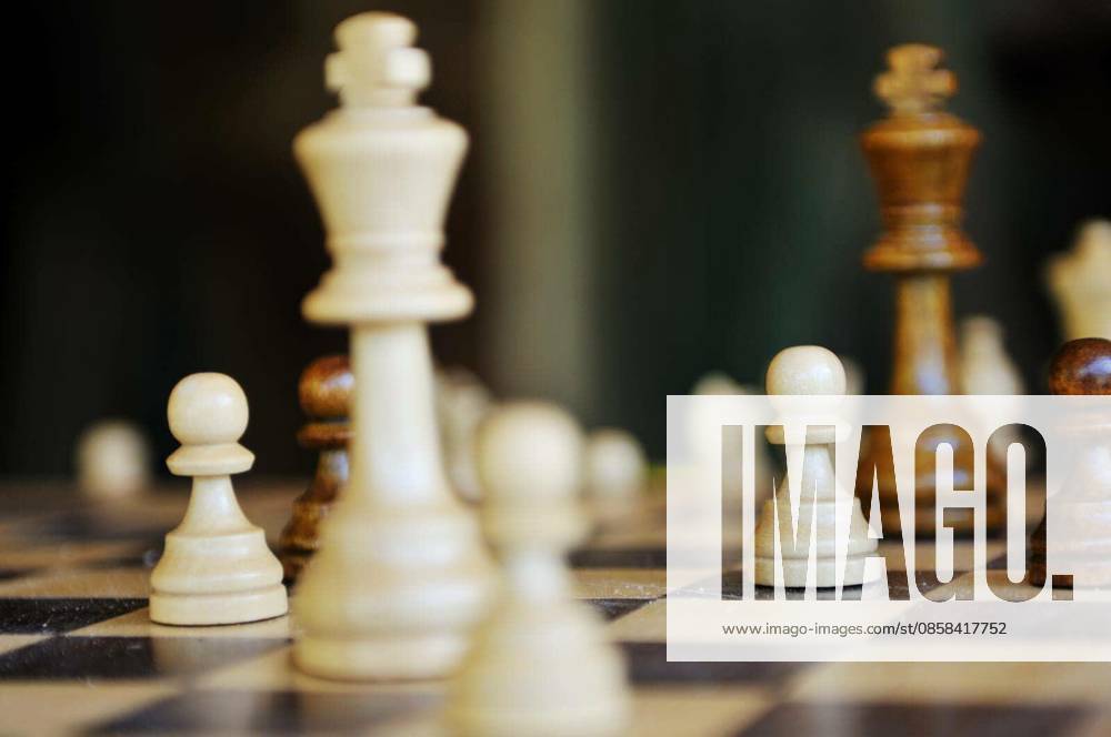 Chess figures arranged on chess table closeup