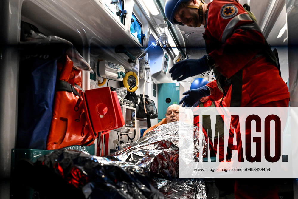 Medics attend to a man, covered with a space blanket, in an ambulance during a response effort to a Russian drone strike on a residential area in the Shevchenkivskyi district of Zaporizhzhia, Ukraine, June 4, 2026. Russian forces launched a drone strike on one of the city’s residential areas, killing one person and injuring 16 others. The blast wave and debris shattered windows and balconies in apartment blocks. (Photo by Dmytro Smolienko Ukrinform) Russian forces launch drone strike on district in Zaporizhzhia