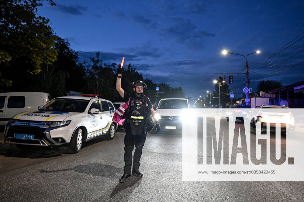 A paramedic gestures at drivers during a response effort to a Russian drone strike in the Shevchenkivskyi district of Zaporizhzhia, Ukraine, June 4, 2026. Russian forces launched a drone strike on one of the city’s residential areas, killing one person and injuring 16 others. The blast wave and debris shattered windows and balconies in apartment blocks. (Photo by Dmytro Smolienko Ukrinform) Russian forces launch drone strike on district in Zaporizhzhia