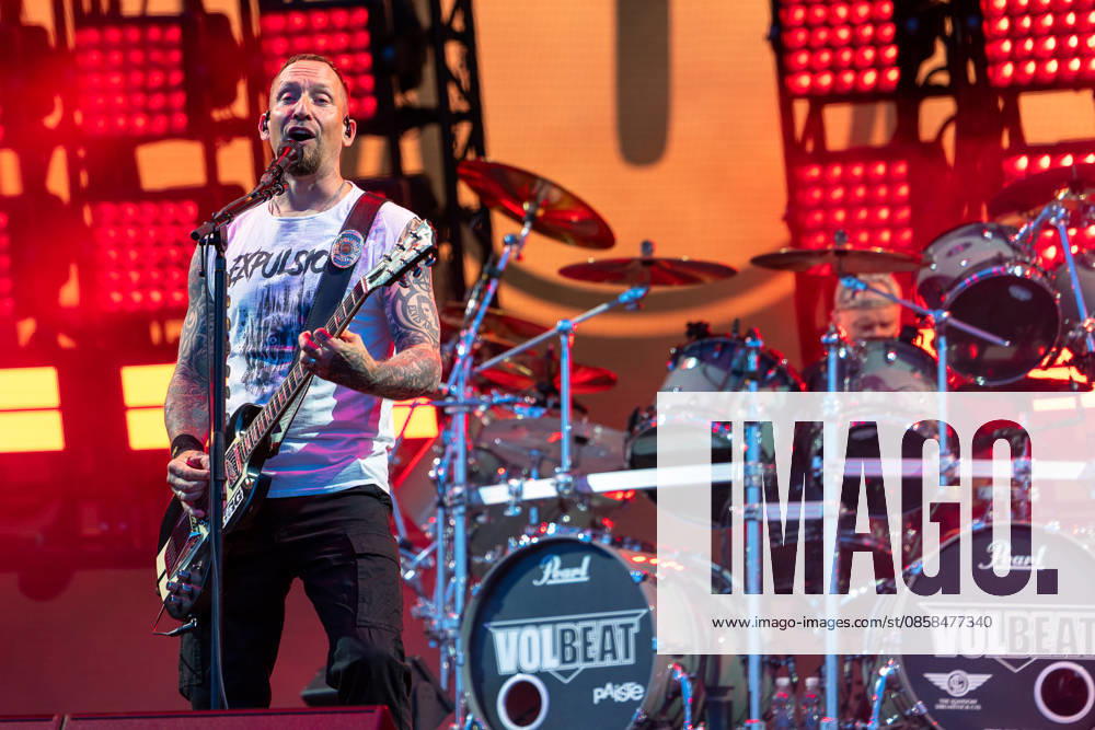 Music festival Rock im Park 2026 Volbeat, Nuremberg, 05 06 2026 Michael Poulsen, singer and guitarist of the Danish rock band Volbeat, performs in front of a red illuminated stage decoration On the drums another band member can be seen behind a Pearl drum set with Volbeat imprint Nuremberg Bavaria Germany 20260605-1V9A9755-M4000