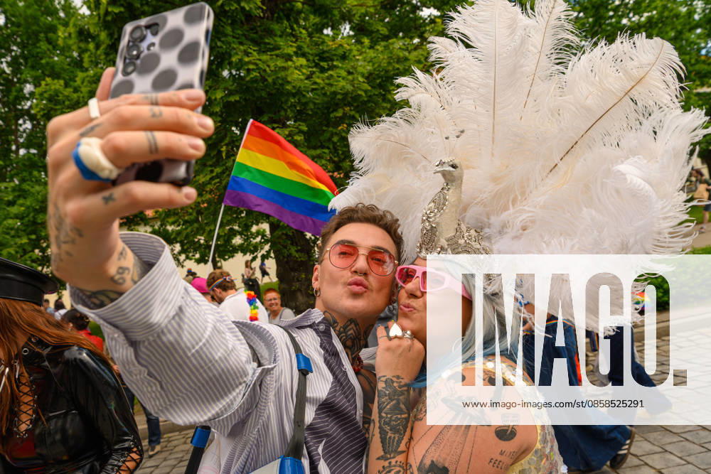 A couple poses for selfies during the pride parade. Vilnius on June 6 marked Lithuanian Pride 2026 with a march for equality, drawing thousands to the city center in a public show of visibility, solidarity, and support for LGBTQ+ rights. Vilnius Lithuania - ZUMAs197 20260606_aaa_s197_184