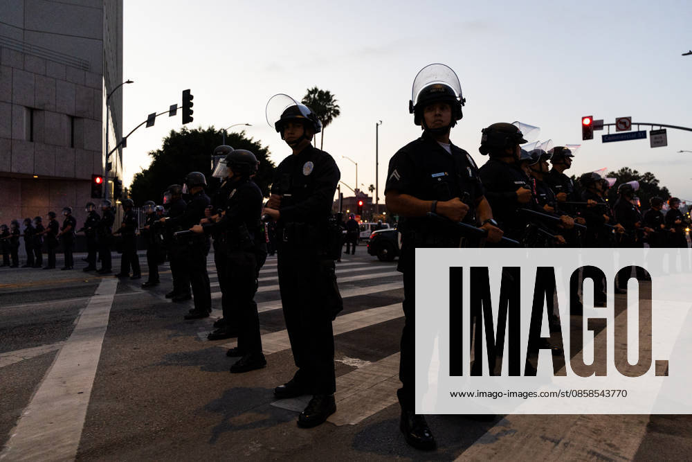LOS ANGELES, CA - JUNE 06: Police officers stand guard outside a federal detention center during an anti-ICE protest on June 6, 2026 in Los Angeles, California.