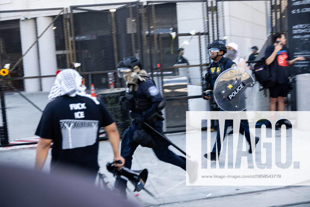 LOS ANGELES, CA - JUNE 06: Police officers chase a protester outside a federal detention center during an anti-ICE protest on June 6, 2026 in Los Angeles, California.
