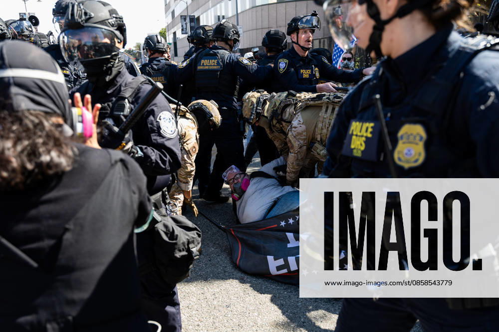 LOS ANGELES, CA - JUNE 06: A protester is arrested by police officers outside a federal detention center during an anti-ICE protest on June 6, 2026 in Los Angeles, California.