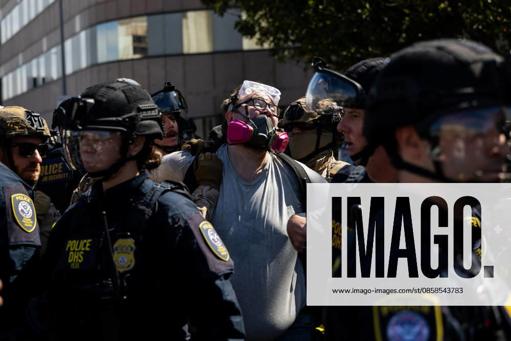 LOS ANGELES, CA - JUNE 06: A protester is arrested by police officers outside a federal detention center during an anti-ICE protest on June 6, 2026 in Los Angeles, California.