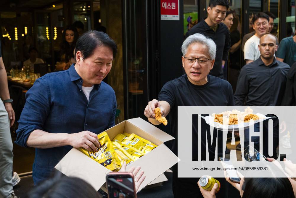 Nvidia founder and CEO JENSEN HUANG and SK Group chairman CHEY TAE-WON take questions from reporters as they hand out fried chicken and chips at Kkanbu Chicken, during Huangâ€⠢s visit to Seoul, South Korea on Sunday, June 7, 2026. Seoul South Korea - ZUMAh163 20260607_znp_h163_011