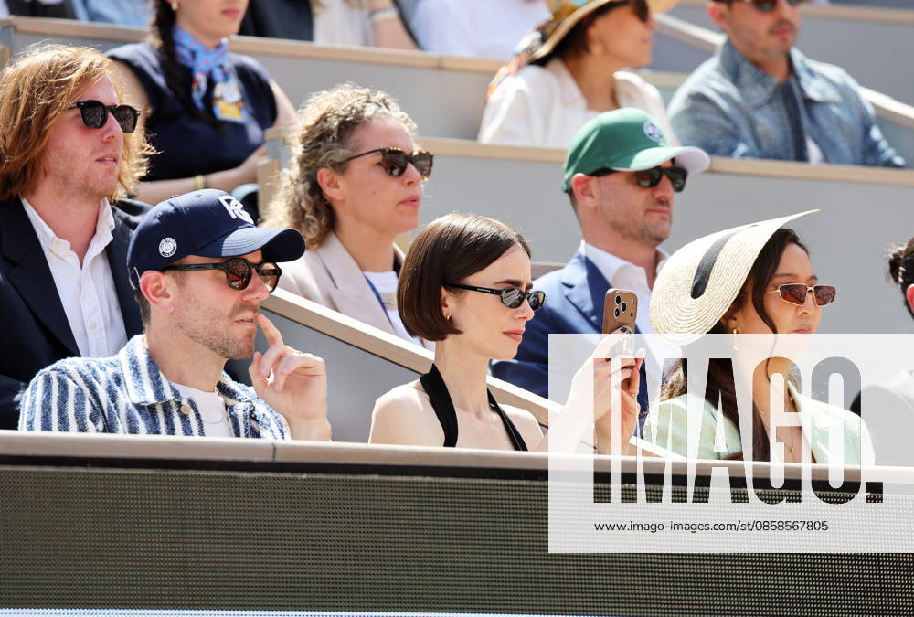 Lily Collins with husband Charlie McDowell and Ashley Park Celebrities in the stands at the mens final of the French Open at Roland Garros 2026 on June 7, 2026 Jacovides Moreau Bestimage Celebrities in the stands at the mens final of the French Open at Roland Garros 2026 on June 7, 2026 Paris France