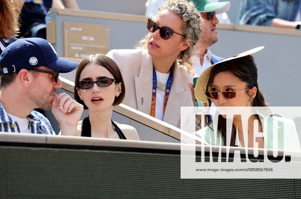 Lily Collins with husband Charlie McDowell and Ashley Park Celebrities in the stands at the mens final of the French Open at Roland Garros 2026 on June 7, 2026 Jacovides Moreau Bestimage Celebrities in the stands at the mens final of the French Open at Roland Garros 2026 on June 7, 2026 Paris France