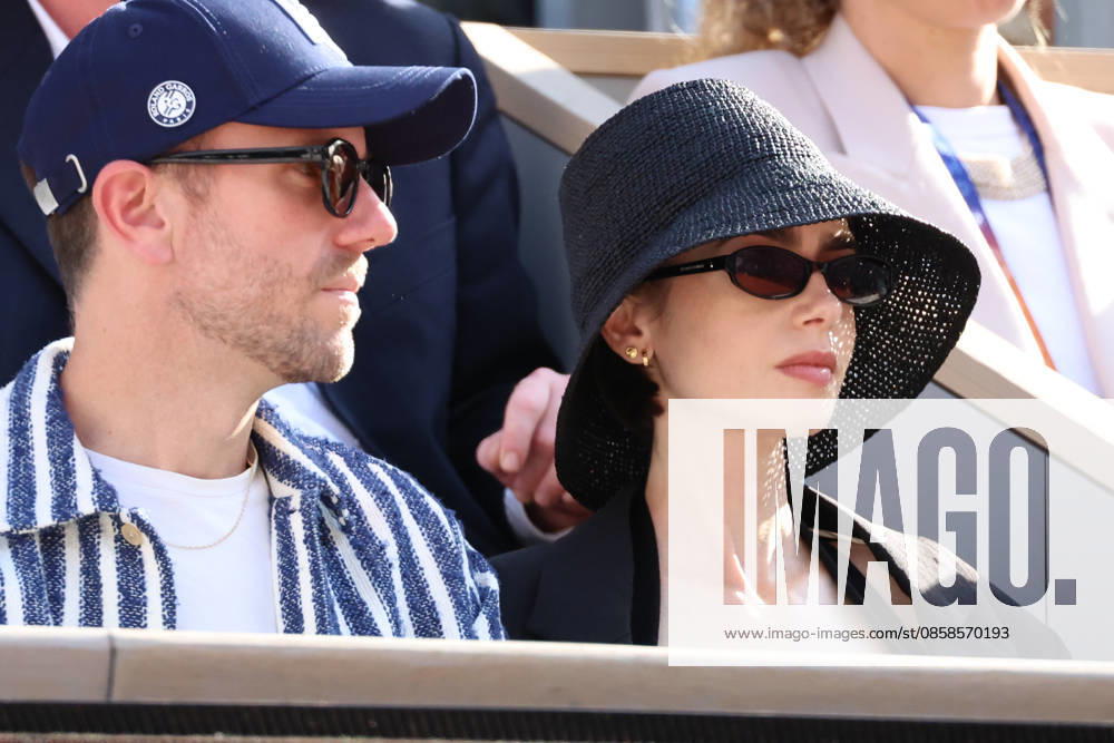 Lily Collins, Charlie McDowell and Ashley Park attend Men s Singles final match of the 2026 French Open at Roland Garros in Paris Lily Collins, Charlie McDowell and Ashley Park attend Men s Singles final match of the 2026 French Open at Roland Garros in Paris, France on June 7, 2026