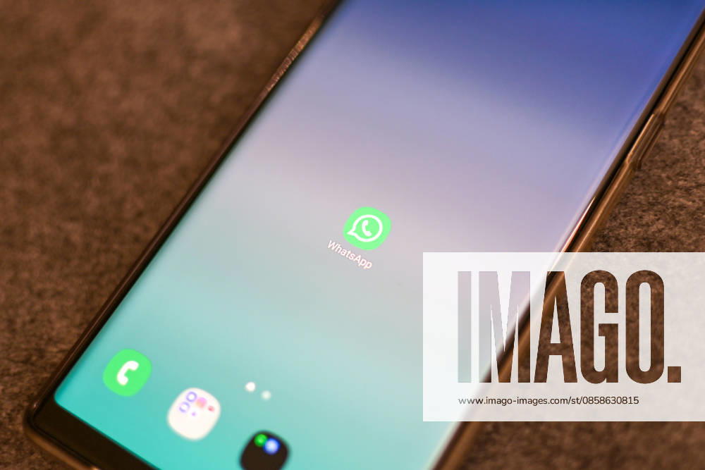The logo of the messenger service WhatsApp on the display of a smartphone WhatsApp is one of the worlds most widely used communication services for messages, voice and video calls Bad Wörishofen Bavaria Germany