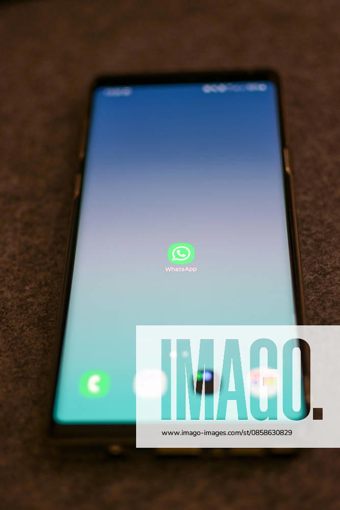 The logo of the messenger service WhatsApp on the display of a smartphone WhatsApp is one of the worlds most widely used communication services for messages, voice and video calls Bad Wörishofen Bavaria Germany