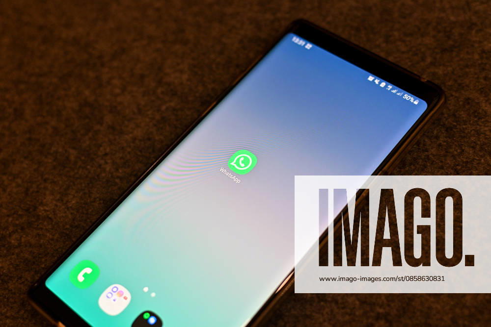 The logo of the messenger service WhatsApp on the display of a smartphone WhatsApp is one of the worlds most widely used communication services for messages, voice and video calls Bad Wörishofen Bavaria Germany