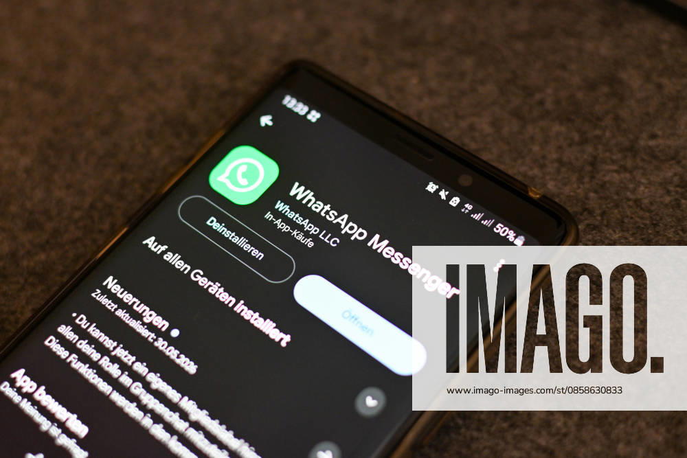 The logo of the messenger service WhatsApp on the display of a smartphone WhatsApp is one of the worlds most widely used communication services for messages, voice and video calls Bad Wörishofen Bavaria Germany