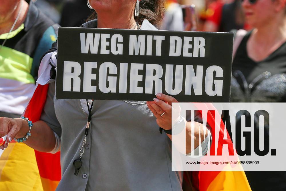 Mitte Demonstration against the federal government Participants hold a sign with the inscription Weg mit der Regierung (Away with the government)