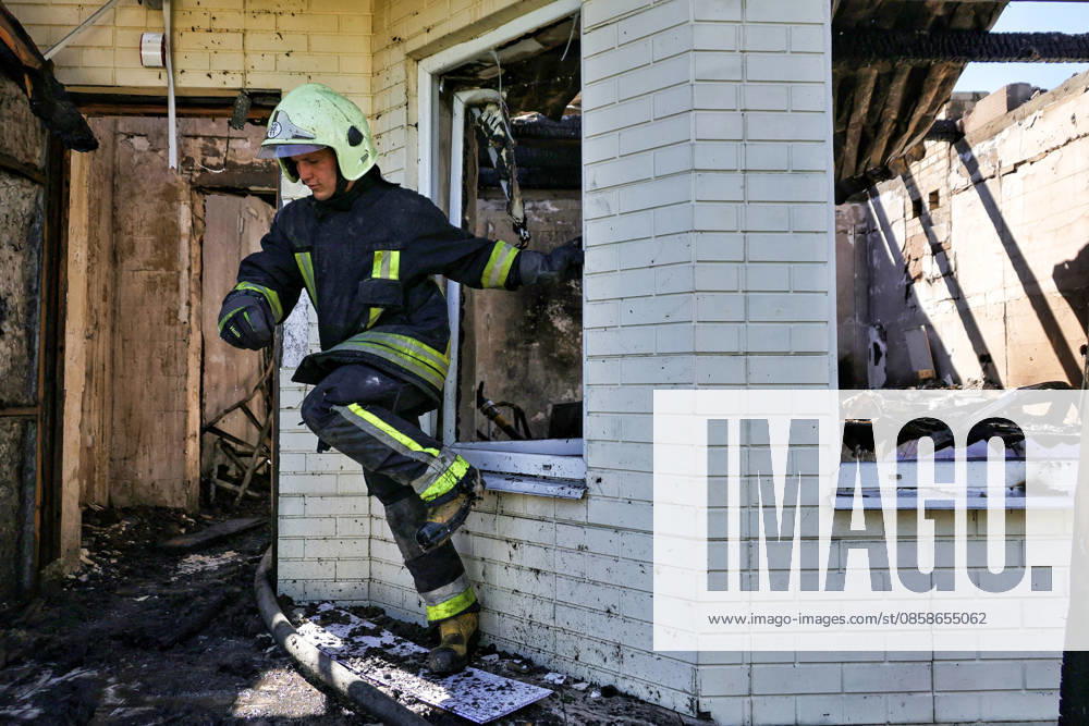 A rescuer steps through a window in a fire-stricken house damaged by a Russian drone attack, Oleksandrivka village, Odesa region, Ukraine, June 8, 2026. (Photo by Nina Liashonok Ukrinform) Russian troops attack Odesa and region with drones