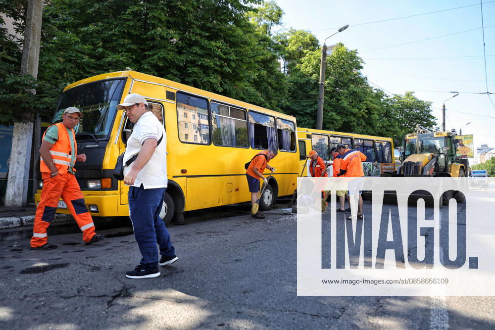 Municipal workers sweep away glass shards near shared taxis after a Russian drone attack, Odesa, Ukraine, June 8, 2026. Russian forces attacked the southern Ukrainian city with Shahed-type drones. The wreckage of a downed drone fell directly onto a public transport stop, damaging the stop itself, as well as a control room, and several shared taxis. Three people were injured. (Photo by Nina Liashonok Ukrinform) Russian troops attack Odesa and region with drones
