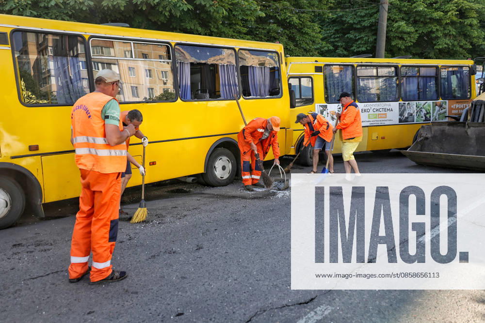 Municipal workers sweep away glass shards near shared taxis after a Russian drone attack, Odesa, Ukraine, June 8, 2026. Russian forces attacked the southern Ukrainian city with Shahed-type drones. The wreckage of a downed drone fell directly onto a public transport stop, damaging the stop itself, as well as a control room, and several shared taxis. Three people were injured. (Photo by Nina Liashonok Ukrinform) Russian troops attack Odesa and region with drones