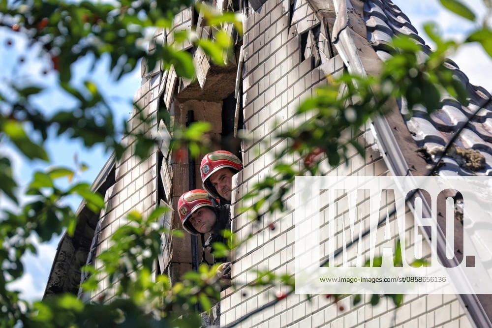 Two firefighters look out of a rooftop window, knocked out in a house by a Russian drone attack, Oleksandrivka village, Odesa region, Ukraine, June 8, 2026. (Photo by Nina Liashonok Ukrinform) Russian troops attack Odesa and region with drones