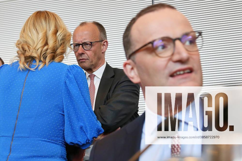 German Bundestag Union parliamentary group meeting Bundestag President Julia Klöckner CDU speaks with Federal Chancellor Friedrich Merz CDU , in the foreground parliamentary group leader Jens Spahn CDU