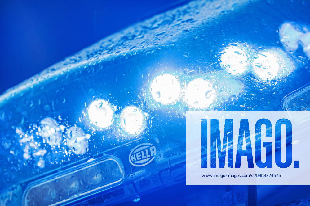Blue light, police on duty, Munich, June 2026 Germany, Munich, June 2026, blue light, police vehicle with blue light, police operation, 110, safety, rain, Bavaria,