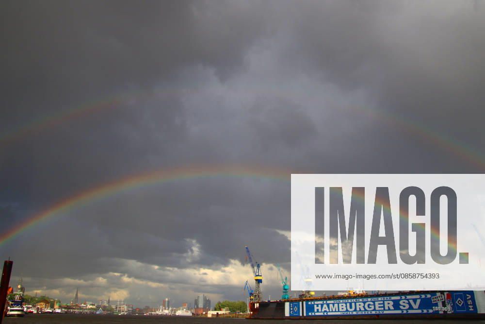 After a thunderstorm, two rainbows appear over the port of Hamburg