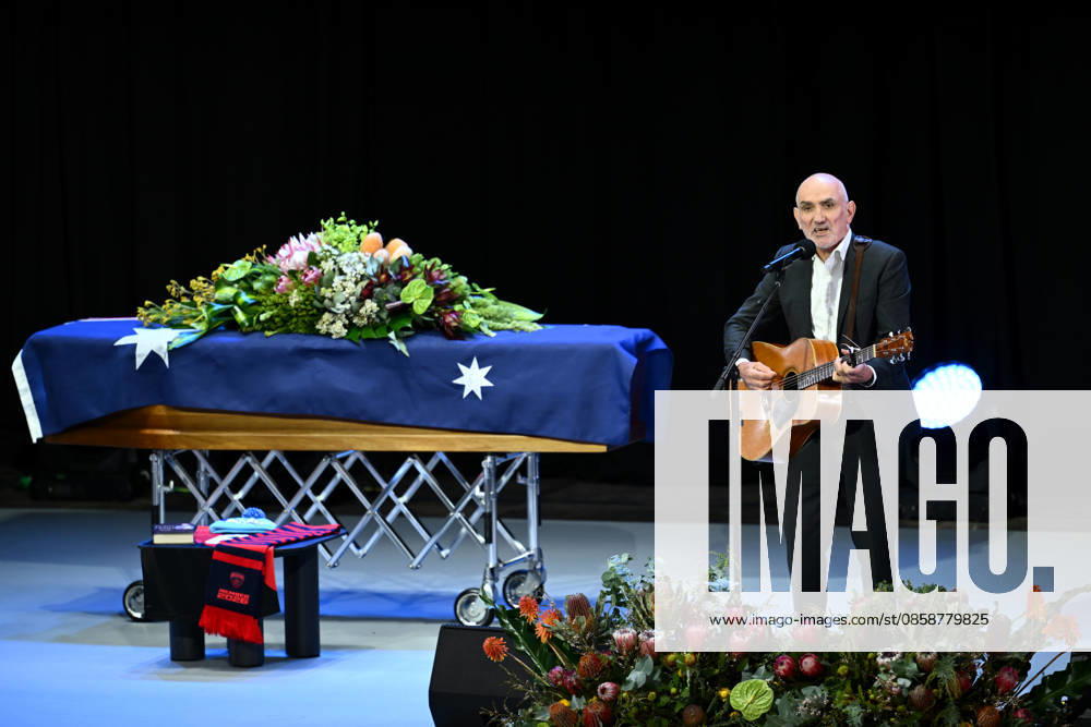 NEALE DANIHER STATE FUNERAL, Paul Kelly performs during a State Funeral Service for Neale Daniher at the MCG, Melbourne, Wednesday, June 10, 2026. A state funeral will honour the life and extraordinary achievements of AFL great Neale Daniher, whose fight against MND inspired countless Australians. ( NO ARCHIVING MELBOURNE VICTORIA AUSTRALIA